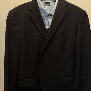 Black suit by Hart Schnaffer Marx.